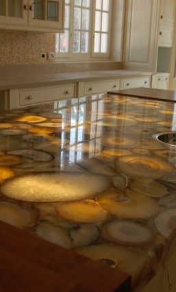 Back lit quartz Granite & Quartz worktop repairs in huddersfield. Fantastic island bar, was all pitted and chipped on the edges and scuffed on the surface.