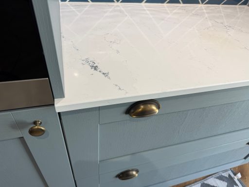After repair: restored quartz in Penistone White quartz worktop edge in Penistone after chip filling, shaping and polishing
